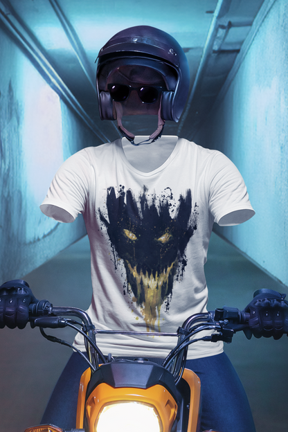 Closeup of a person sitting on a motorcycle in a dimly lit tunnel with graffiti on the walls while wearing a cool T-shirt from Kim Diaz Holm.
